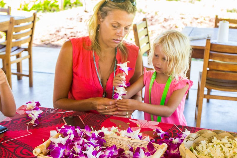 mother and child making Lei 