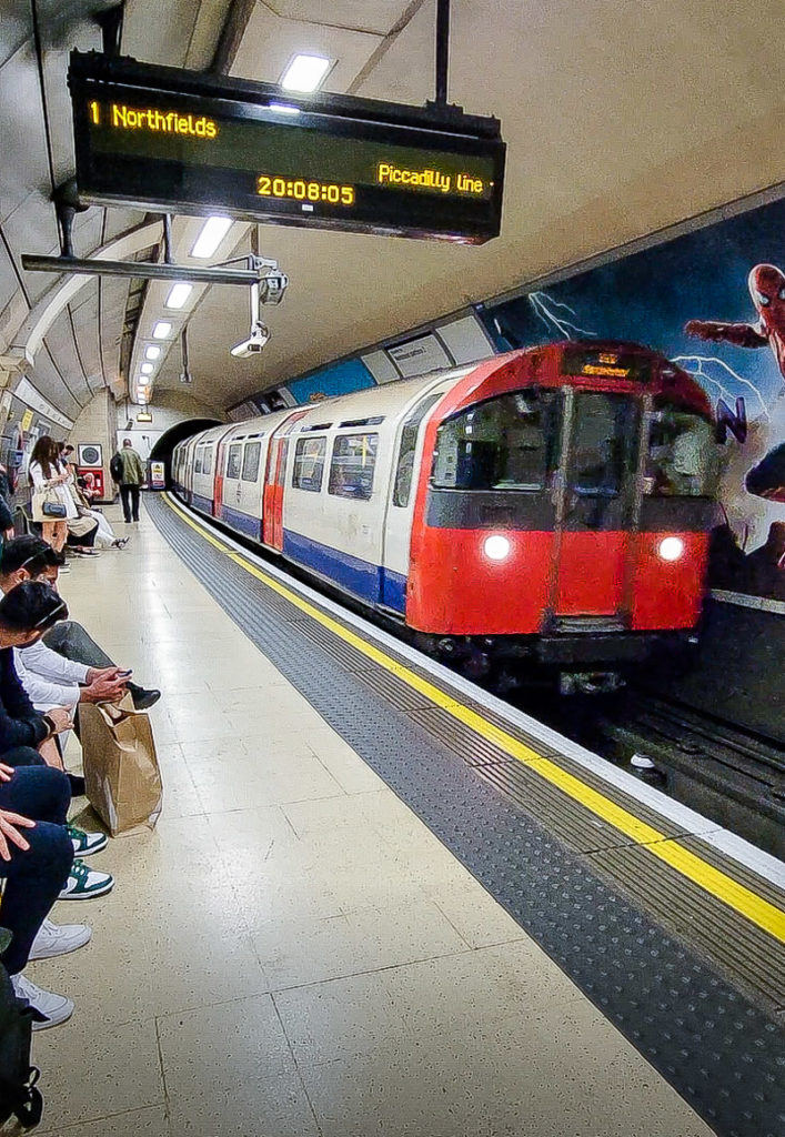 A group of people sitting at a train station