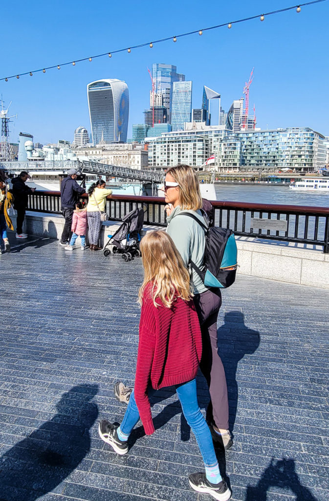 family walking along Southbank in London