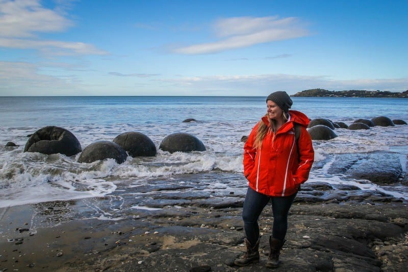 woman on beach in Moeraki 