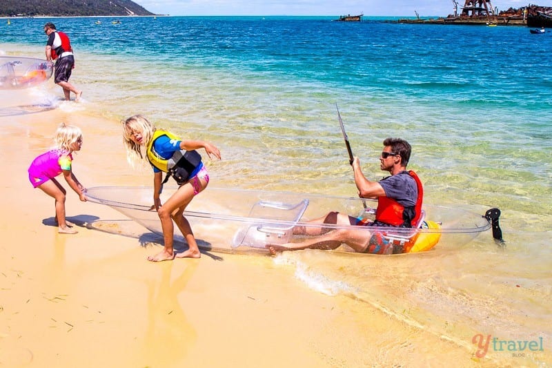 people playing in the ocean