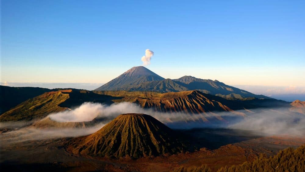 mt bromo volcano with smoke rising