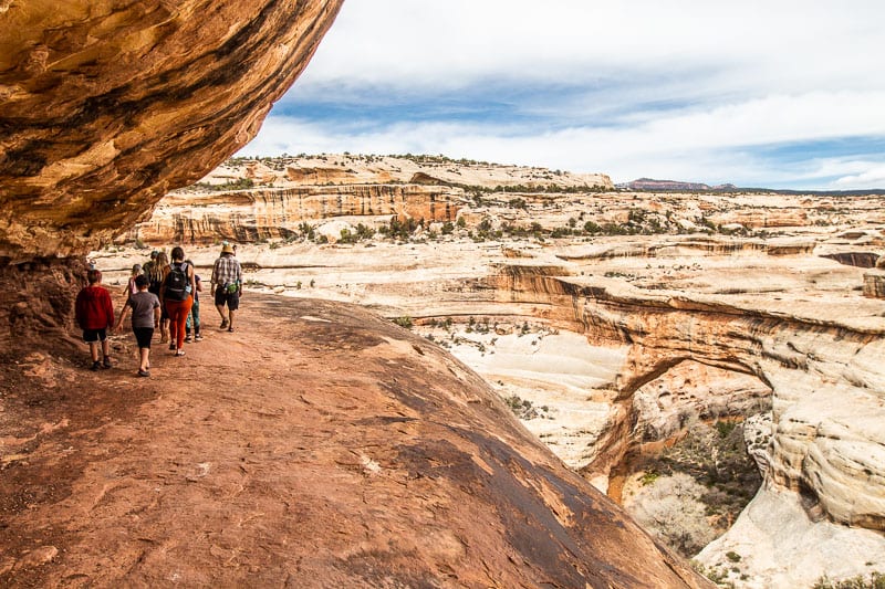 people on the Sipapu Bridge hike in Utah