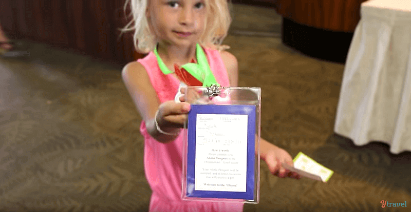 girl holding Kids passport at Kaanapali Beach Hotel