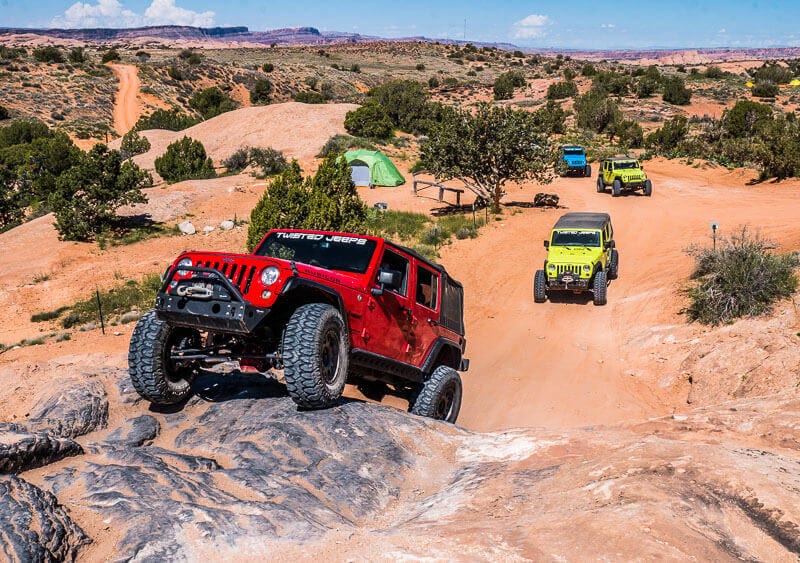 cars driving up rocks