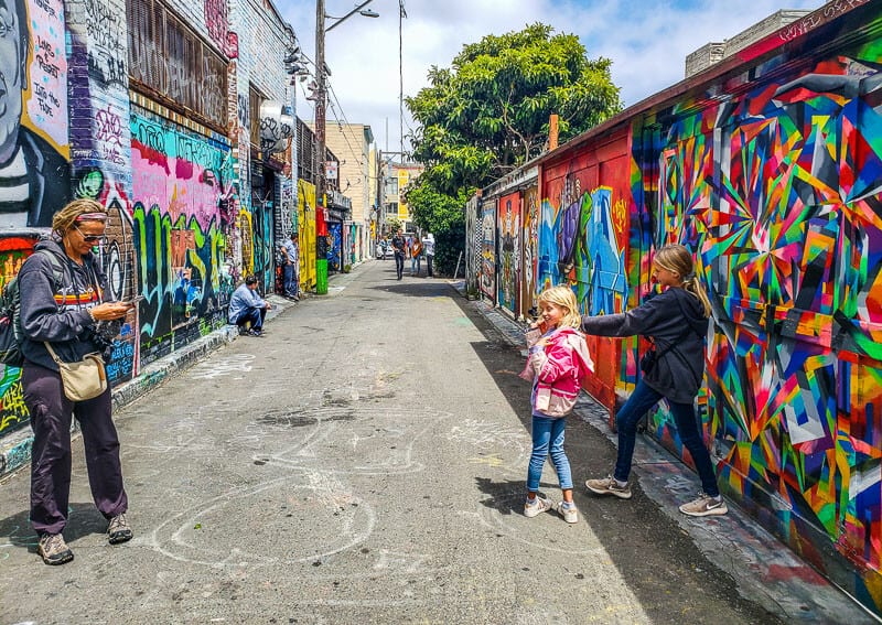 family posing at Mission District murals