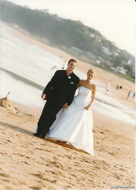 bridge and groom walking on the beach