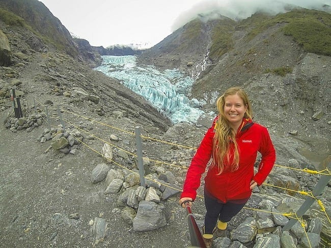 girl Use a selfie stick in front of glacier