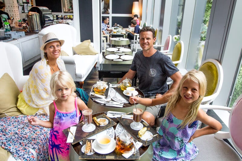 people sitting at a table with food