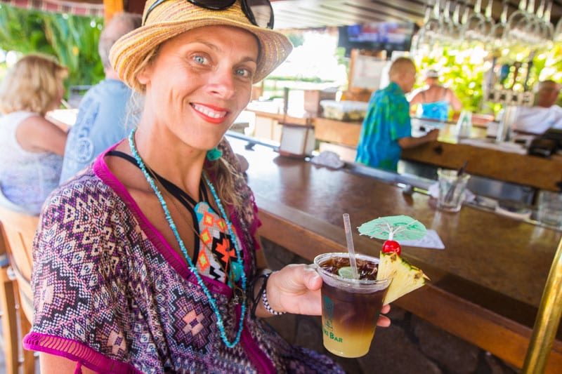 woman drinking cocktail at the tiki Bar at the Kaanapali Beach Hotel