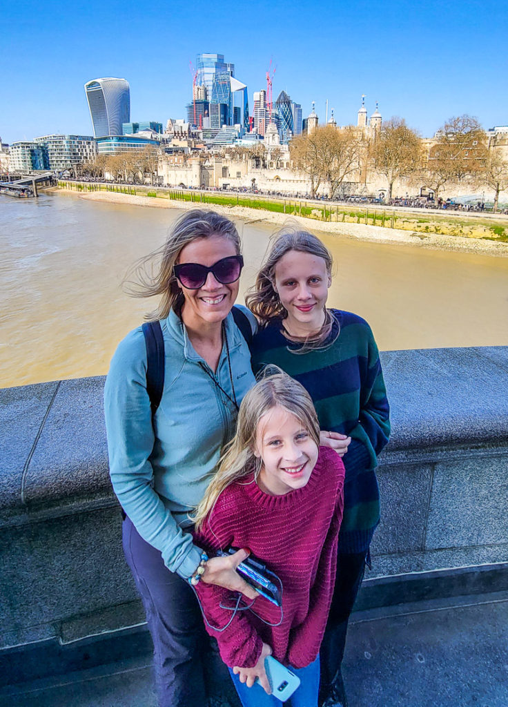 family posing on  Tower Bridge, London