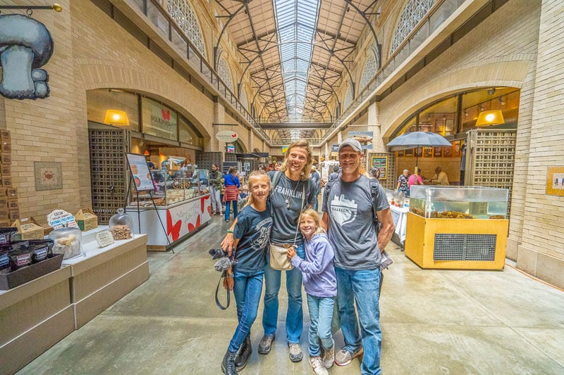 family posing inside ferry building