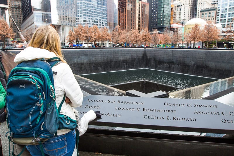 woman looking at a memorial