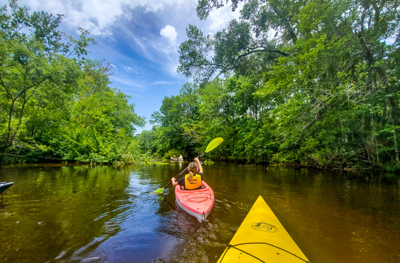 young girl kayaking The Slave Canal, Florida