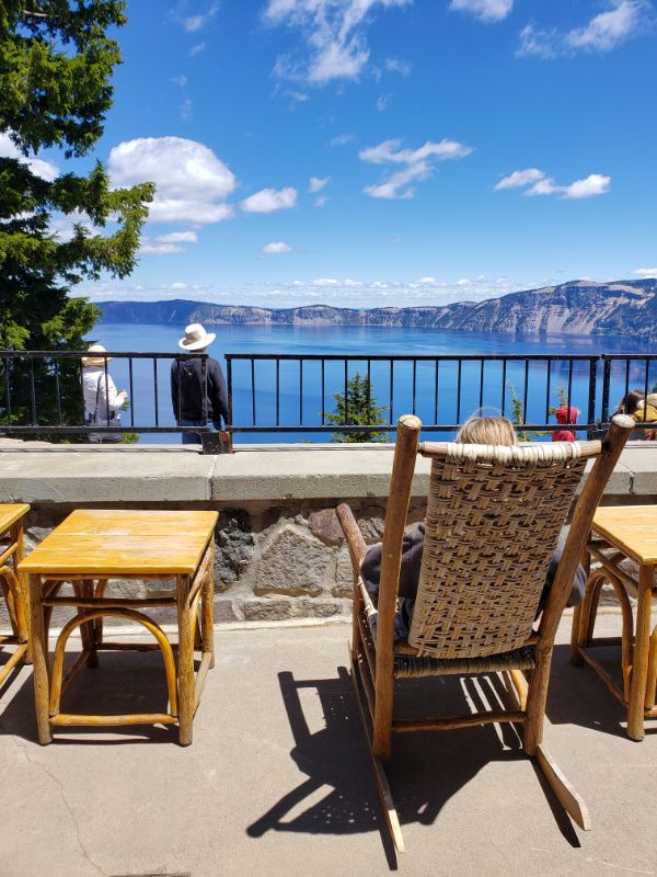 girl on rocking chair on patio