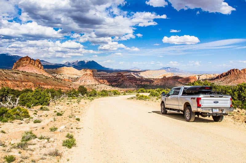 car on dirt road on Burr Trail Capitol Reef NP