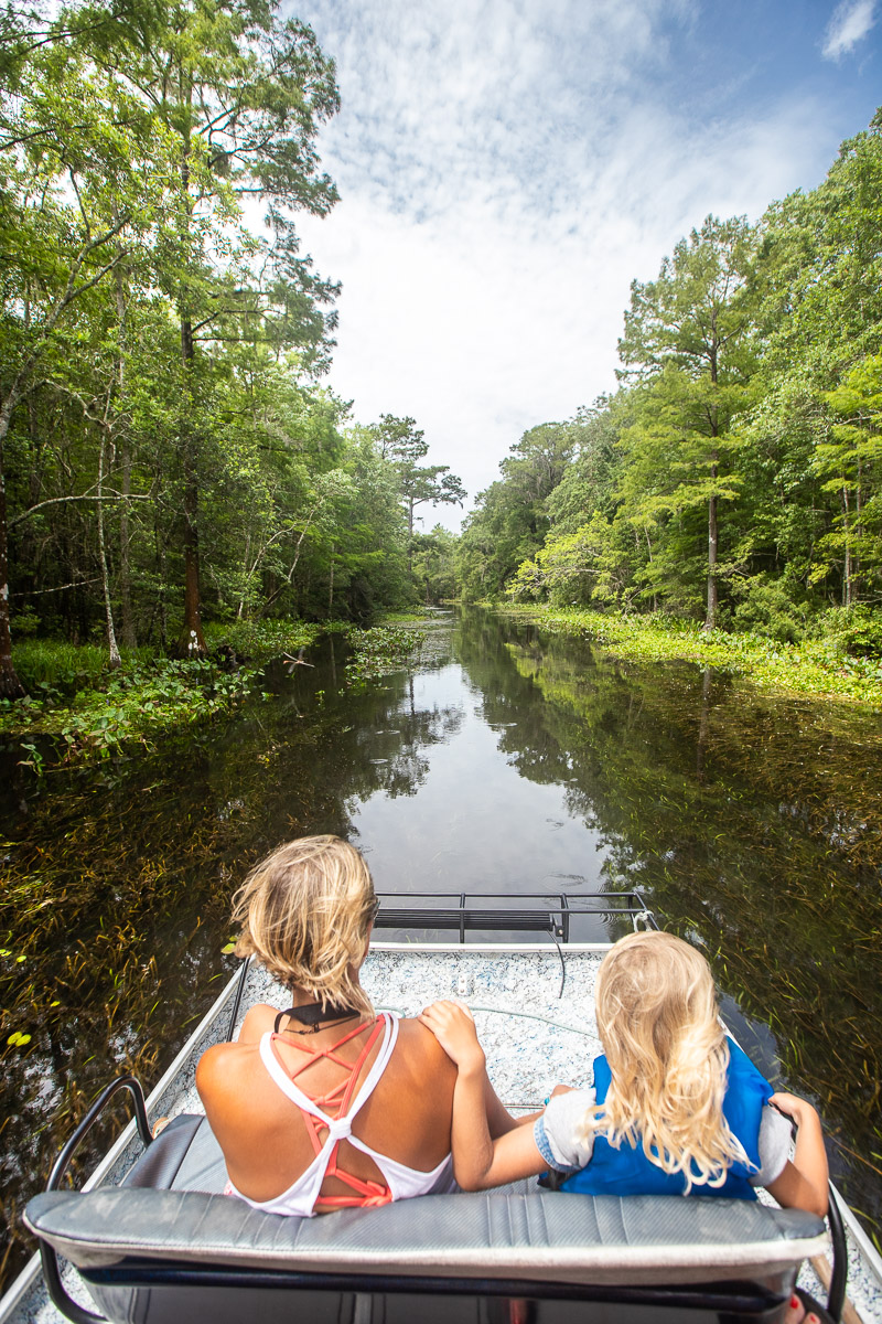 mother and child on airboat on wacissa river