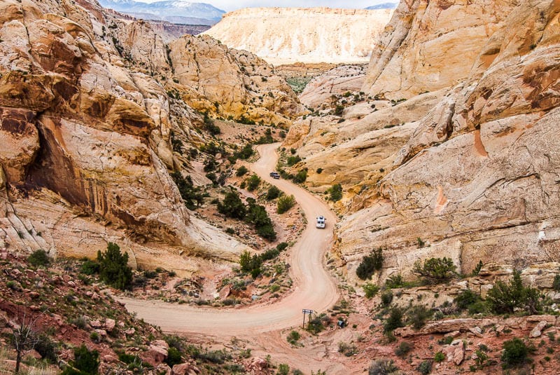 aerial of orange dirt road winding through Burr Trail, Utah