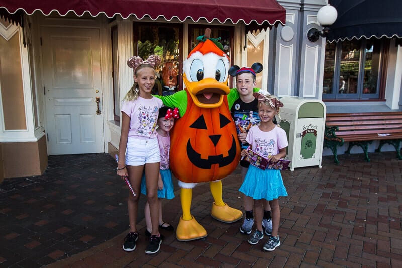 kids Meeting Donald Duck in Disneyland