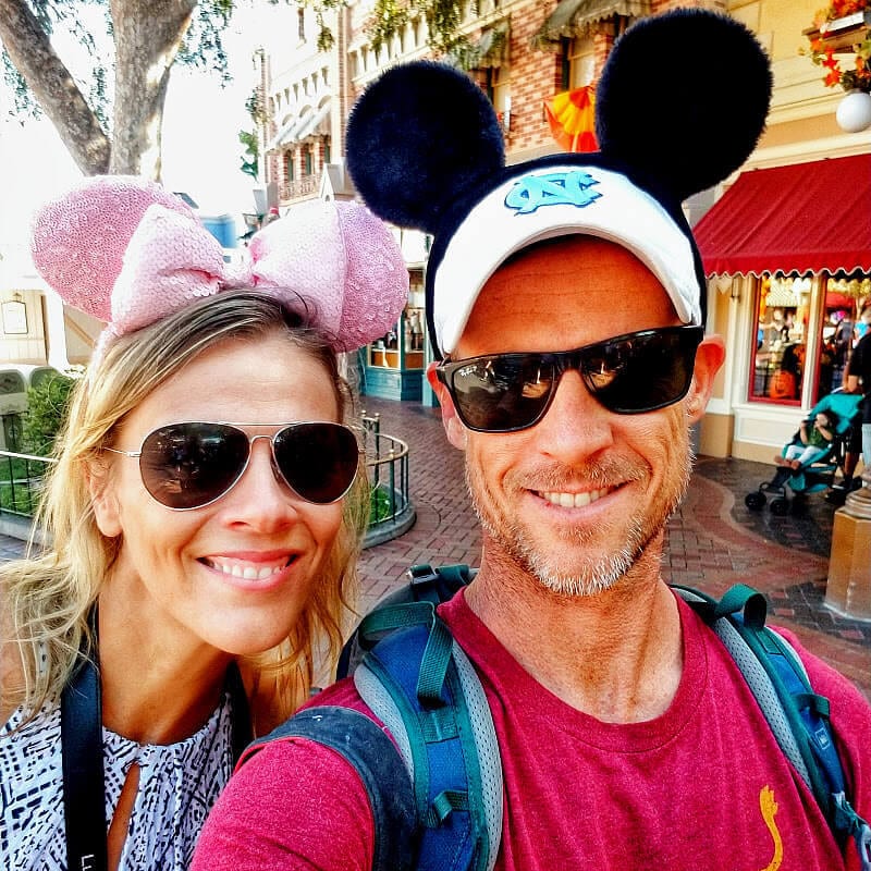 people smiling with mouse ears on