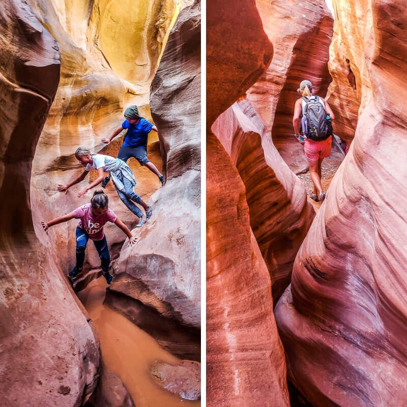 people walking through a narrow canyon