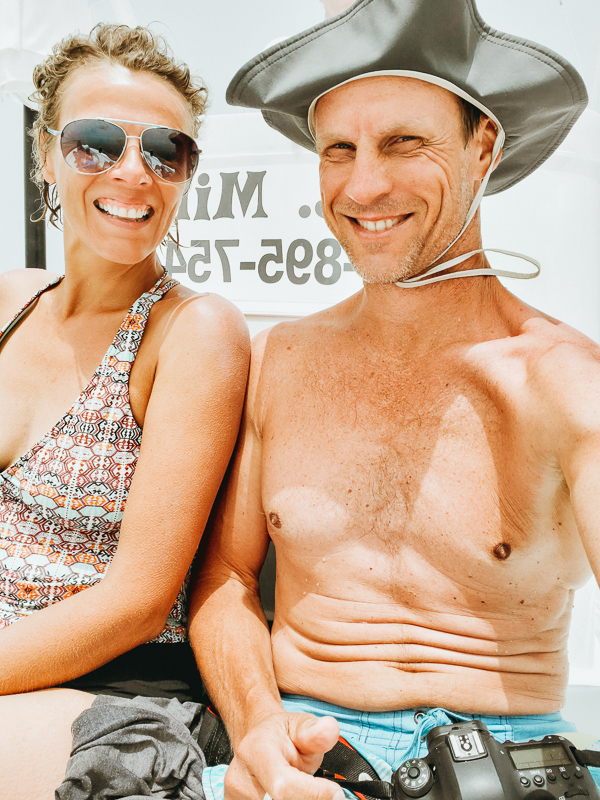 man and woman on boat smiling