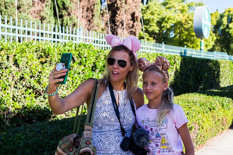 woman and child with mouse ears on at disneyland