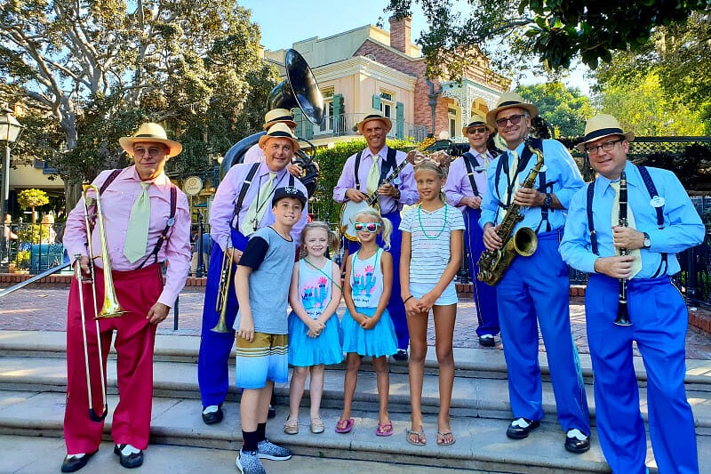 young kids posing with jaZZ band at New Orleans Square