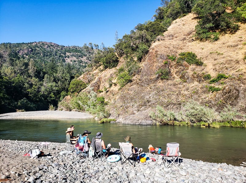 people sitting on chairs beside Russian River, California