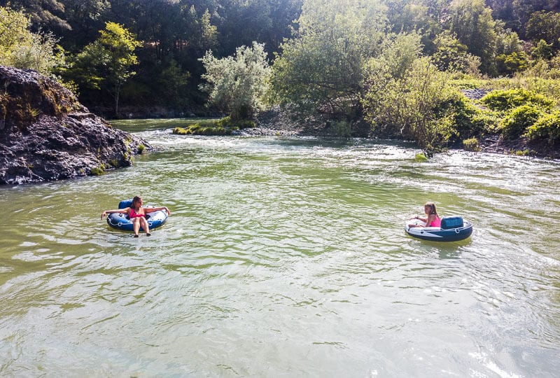 people tubing in a river