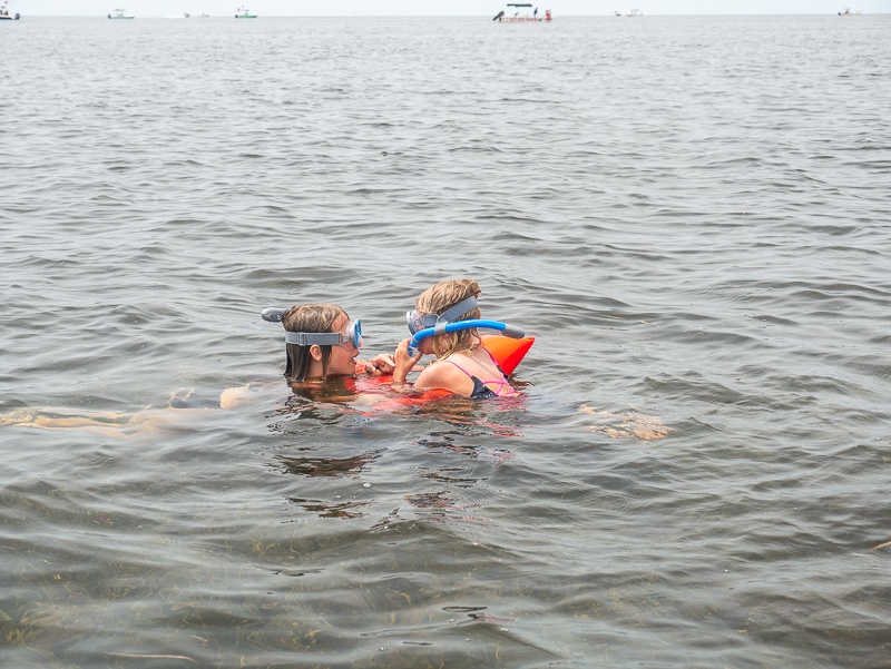 two girls snorkeling together