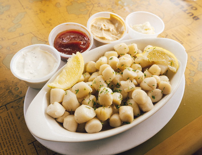 bowl of scallops with sauces