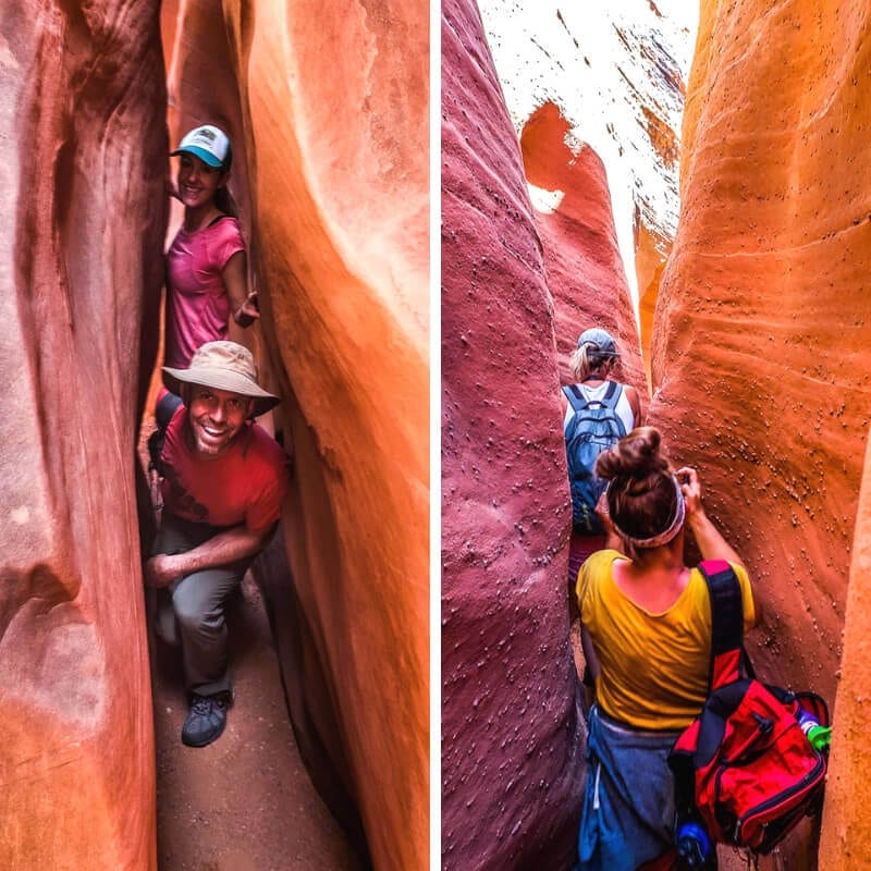 people walking through a narrow canyon