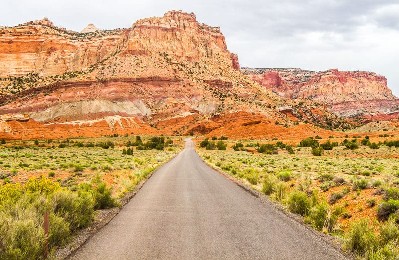 road leading to orange cliffs on the Capitol Reef Scenic Drive