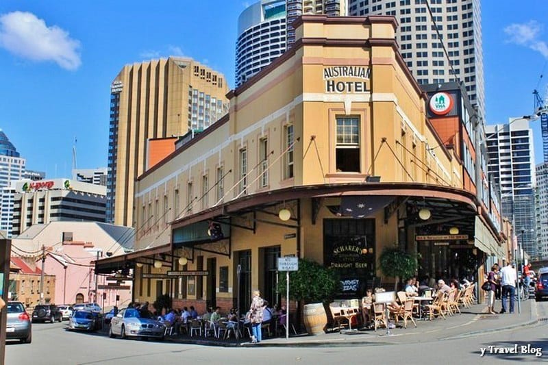 tables and chairs on foorpath outside australia hotel in the rocks