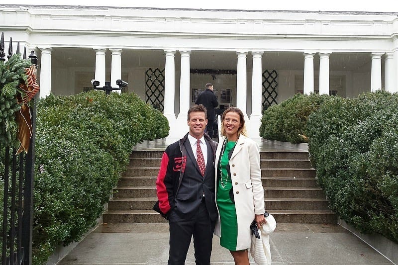 man and woman posing in front of the The White House