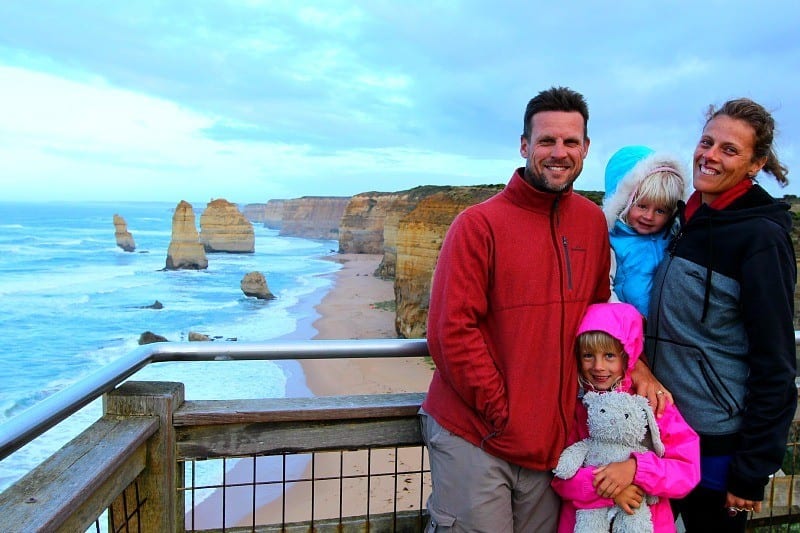 family posing with view of 12 Apostles, Great Ocean Road