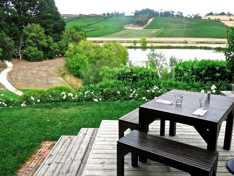 A wooden bench sitting in the grass