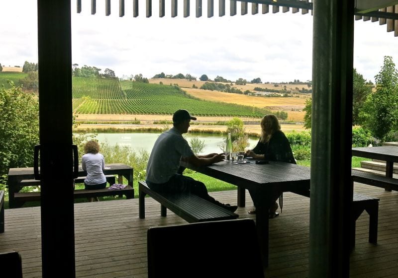 people sitting at a table outside