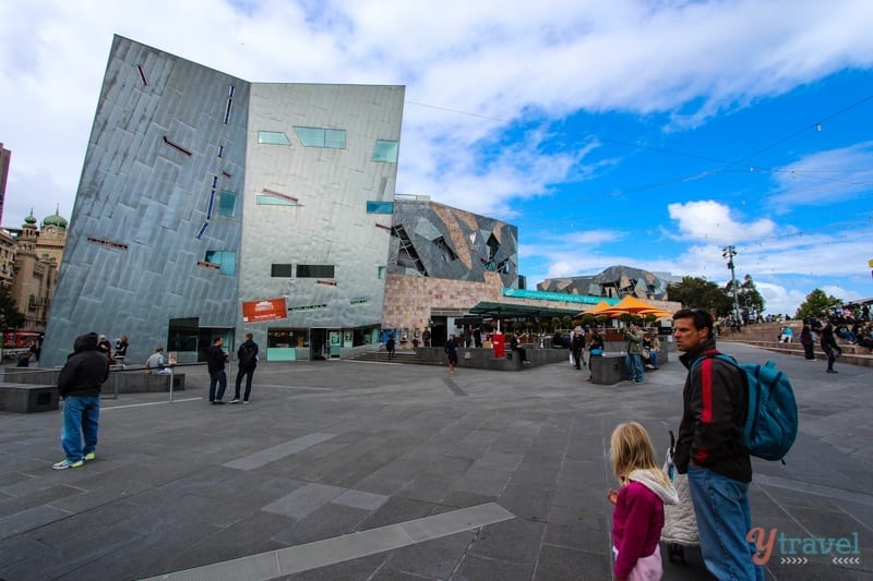 man and child in Federation Square - 