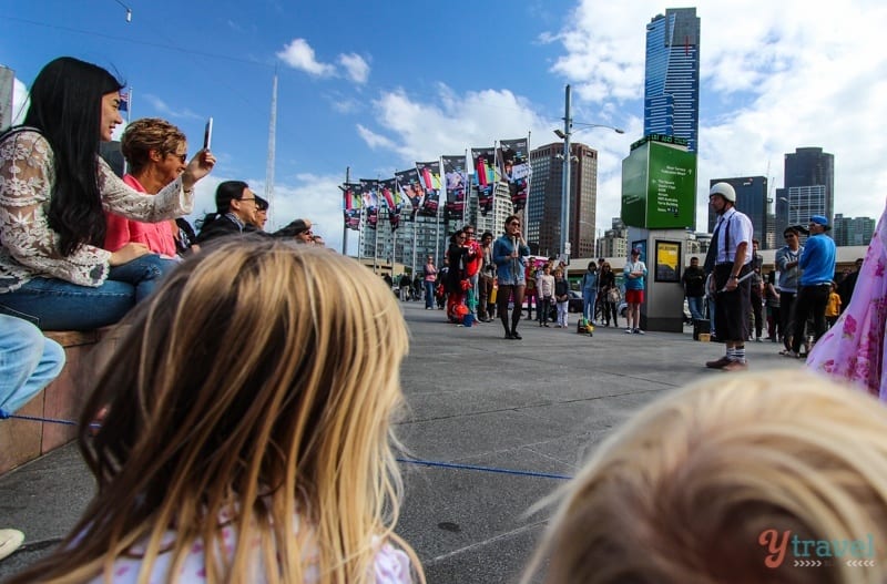 Kalyra & Savannah watching a busker at FEd Square