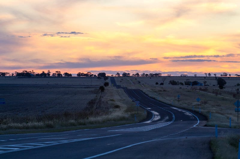 outback queensland sunset over road