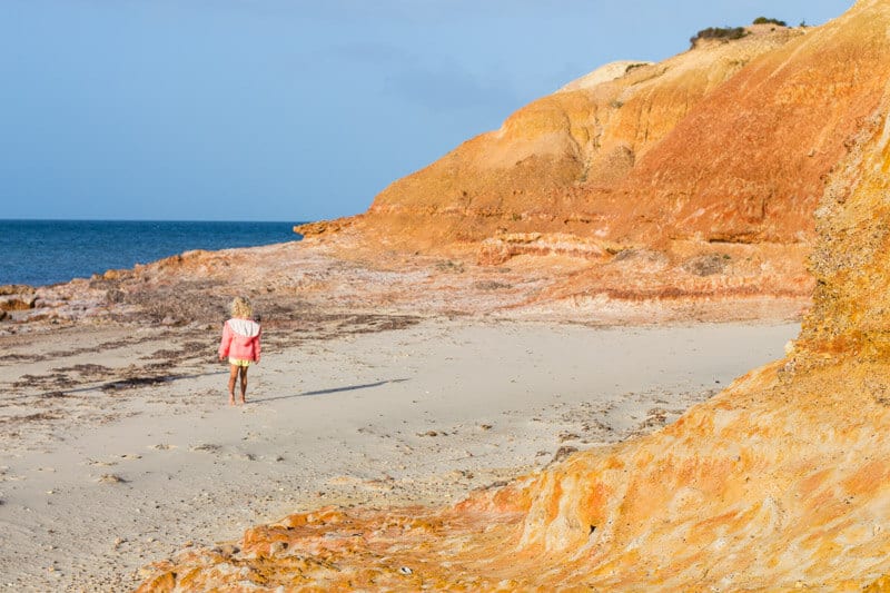 young girl on beach at Redbank Cliffs in American River 