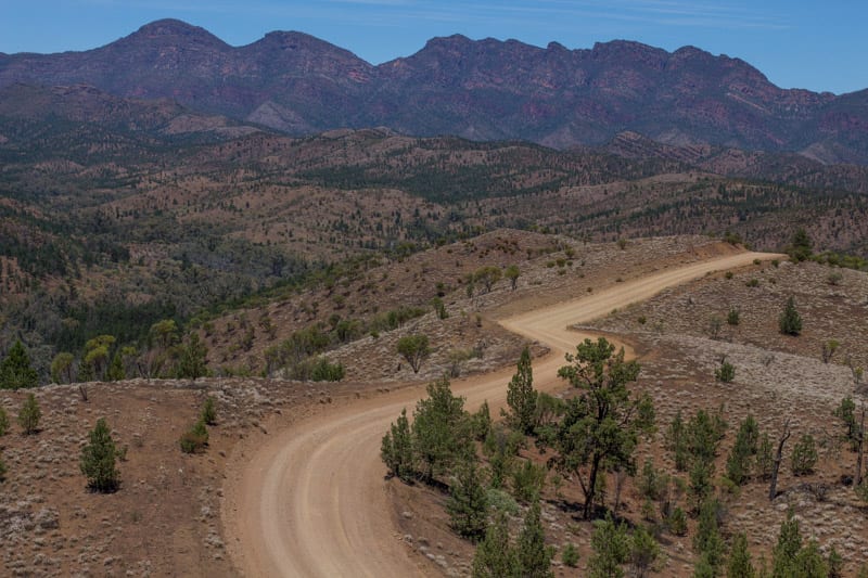 mountains next to a dirt road