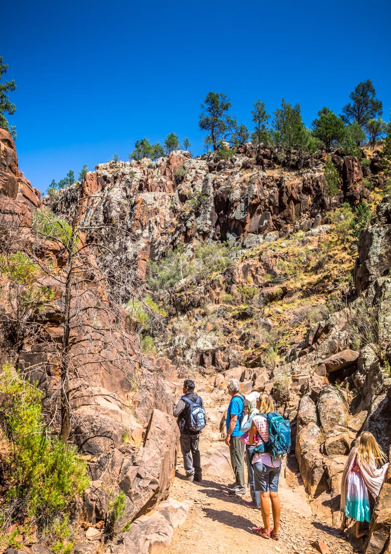 people walking up rocks