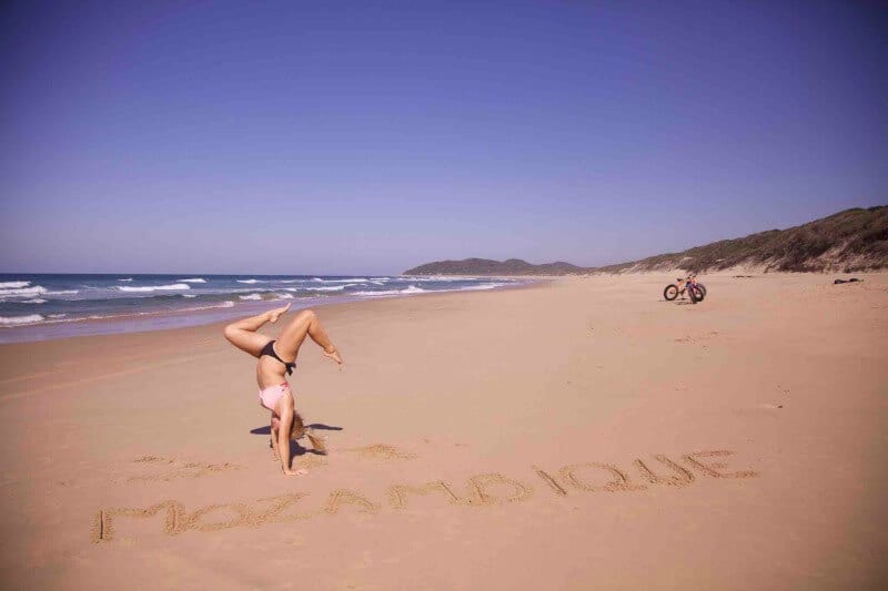 woman doing handstand on Secluded beach in Mozambique