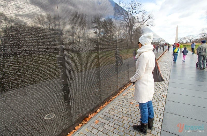 woman looking at Vietnam War Memorial - Washington DC