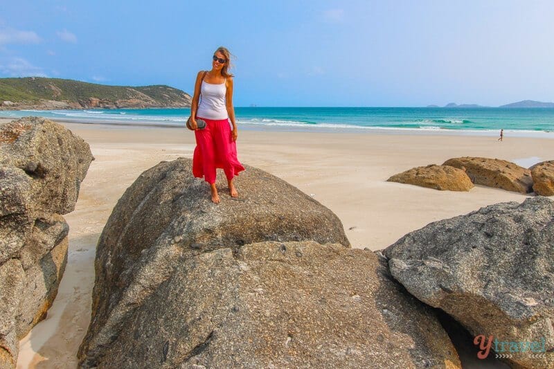 woman standing on rock in on squeaky beach wilsons prom