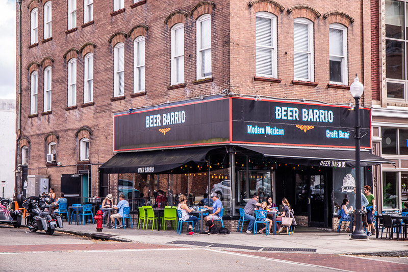 people sitting in front of a restaurant