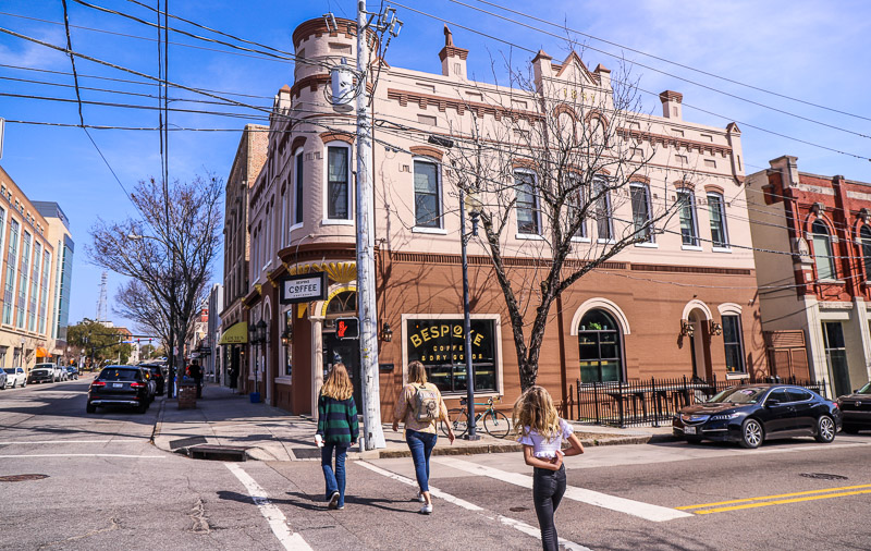 people walking across a street